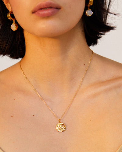 Model wearing Alighieri Cancer Zodiac Necklace Medallion