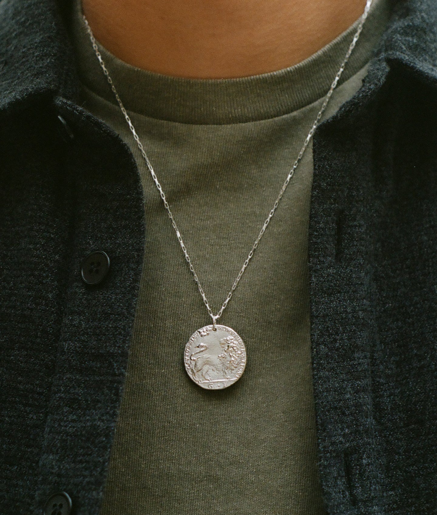 Silver necklace store medallion